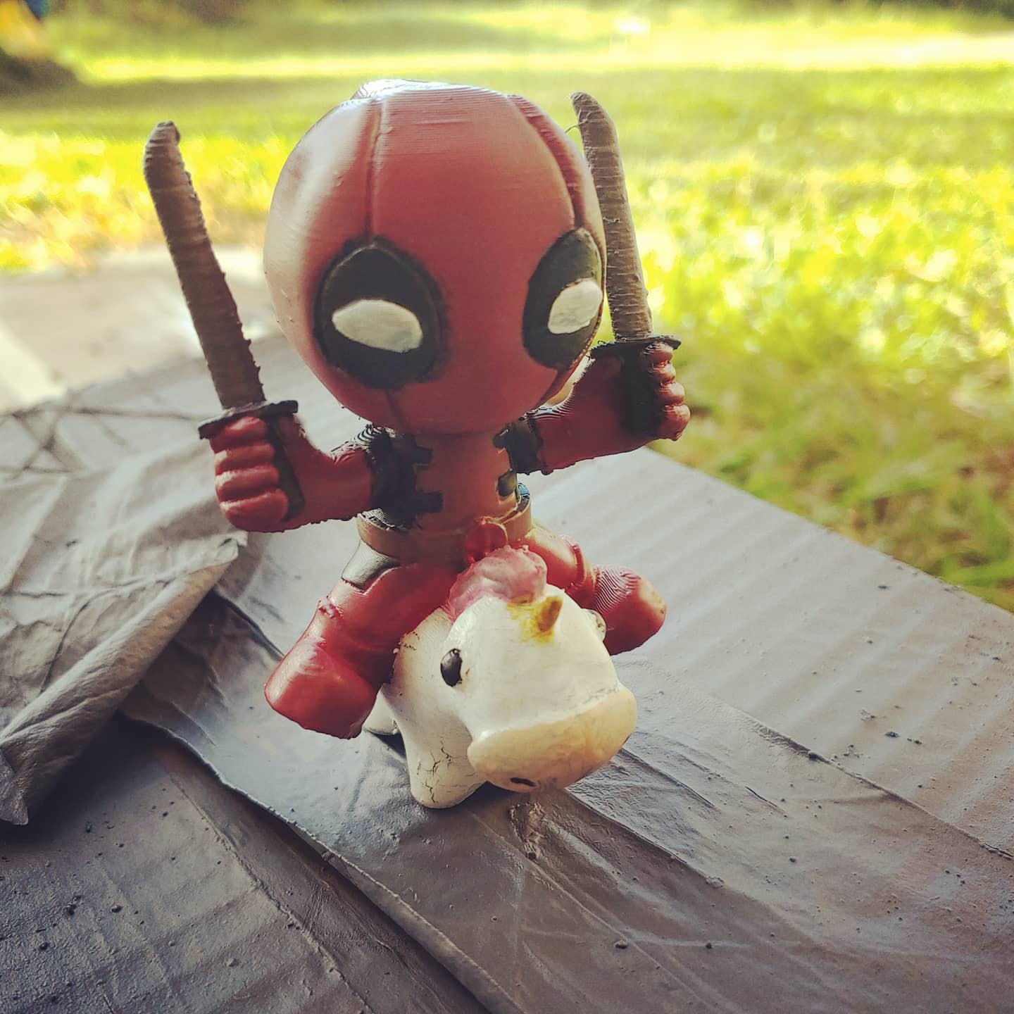 Chibi Deadpool on a Unicorn